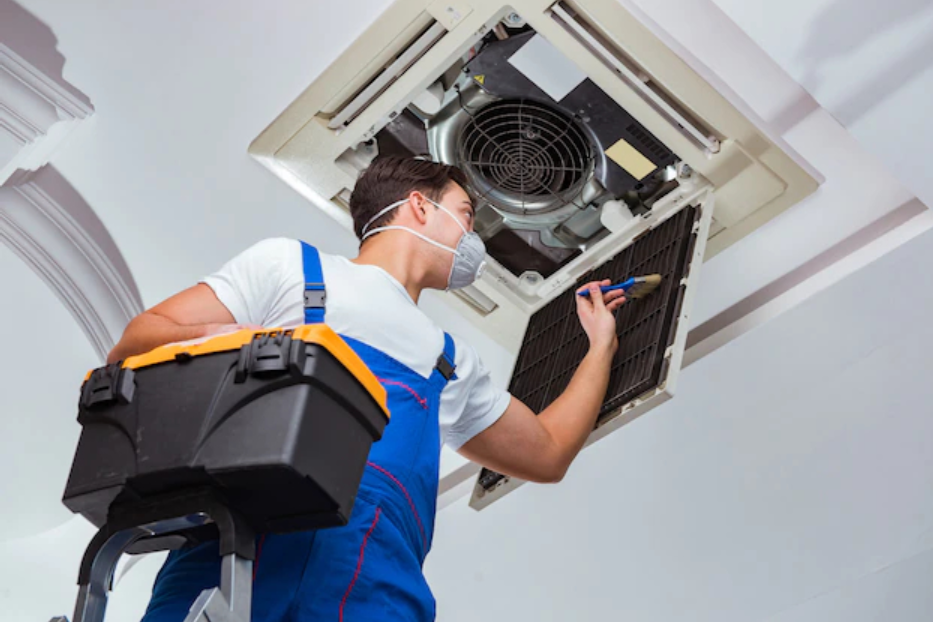 Technician cleaning a supply vent in a Tennessee home showing how vent count affects air duct cleaning cost