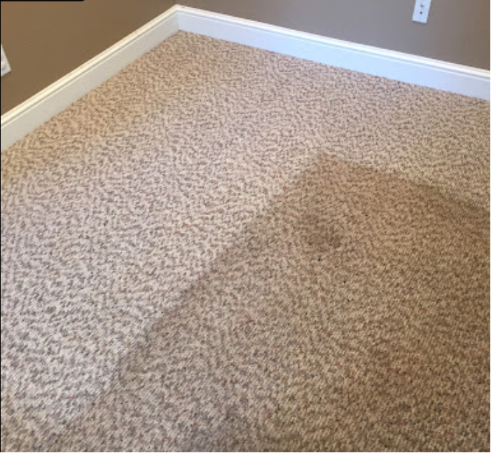 Spoon and white vinegar spray bottle next to green slime on carpet showing how to get slime out of carpet